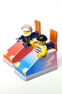 Photo of two lego men in paper bumper cars