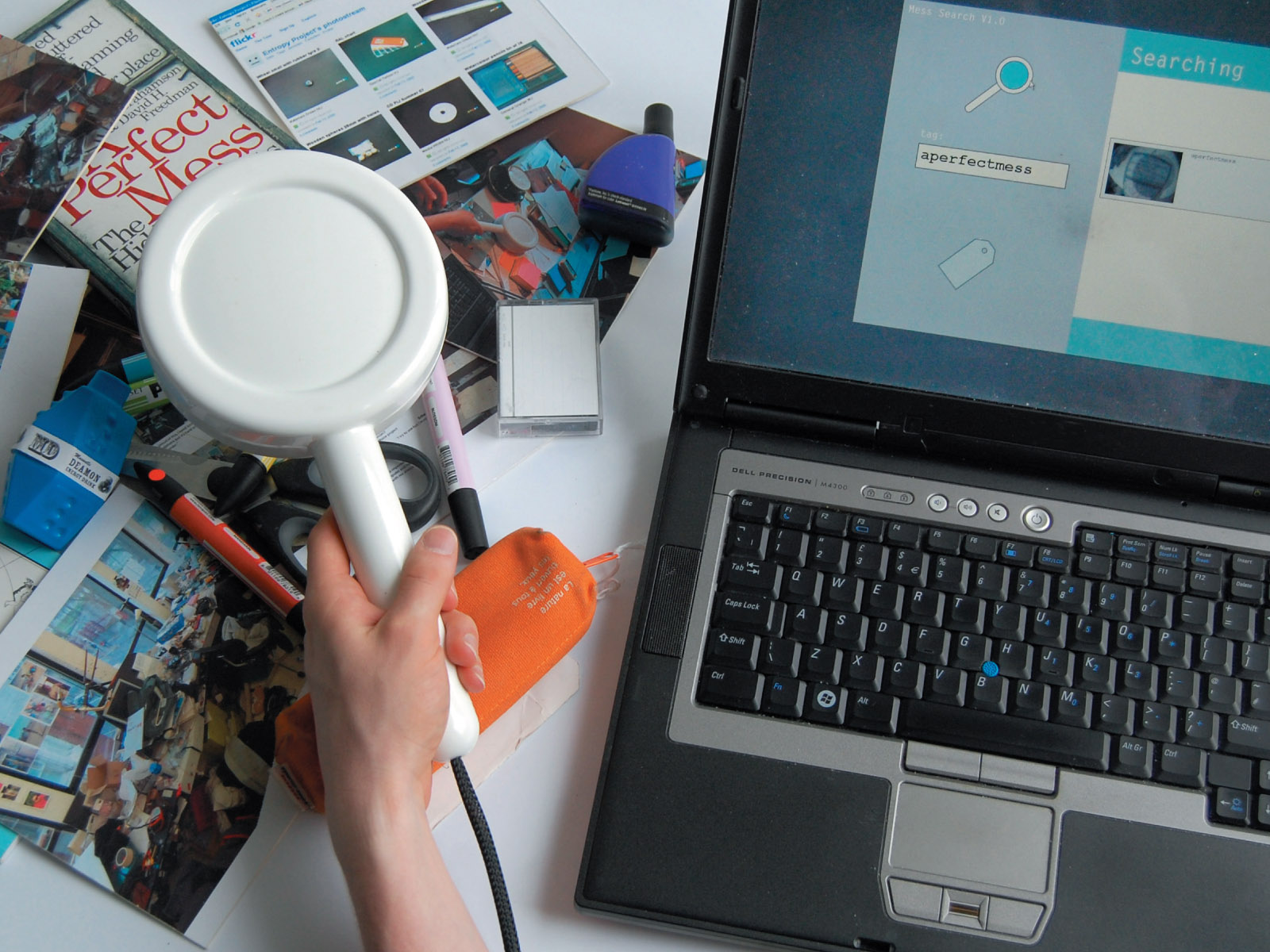 The MessSearch, a plastic magnifying glass scanning a desk